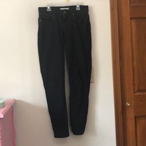 Levi’s black 711 skinny jeans size 28 mid-rise